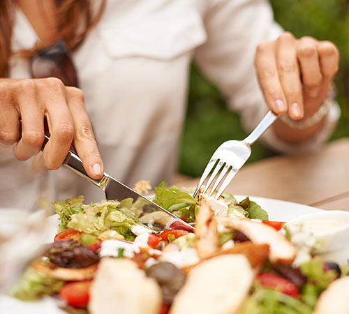 Person eating salad